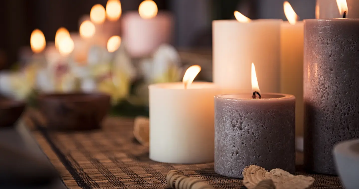 Hypnosis for better sleep in Dutchess County NY, candles burning in warm low light