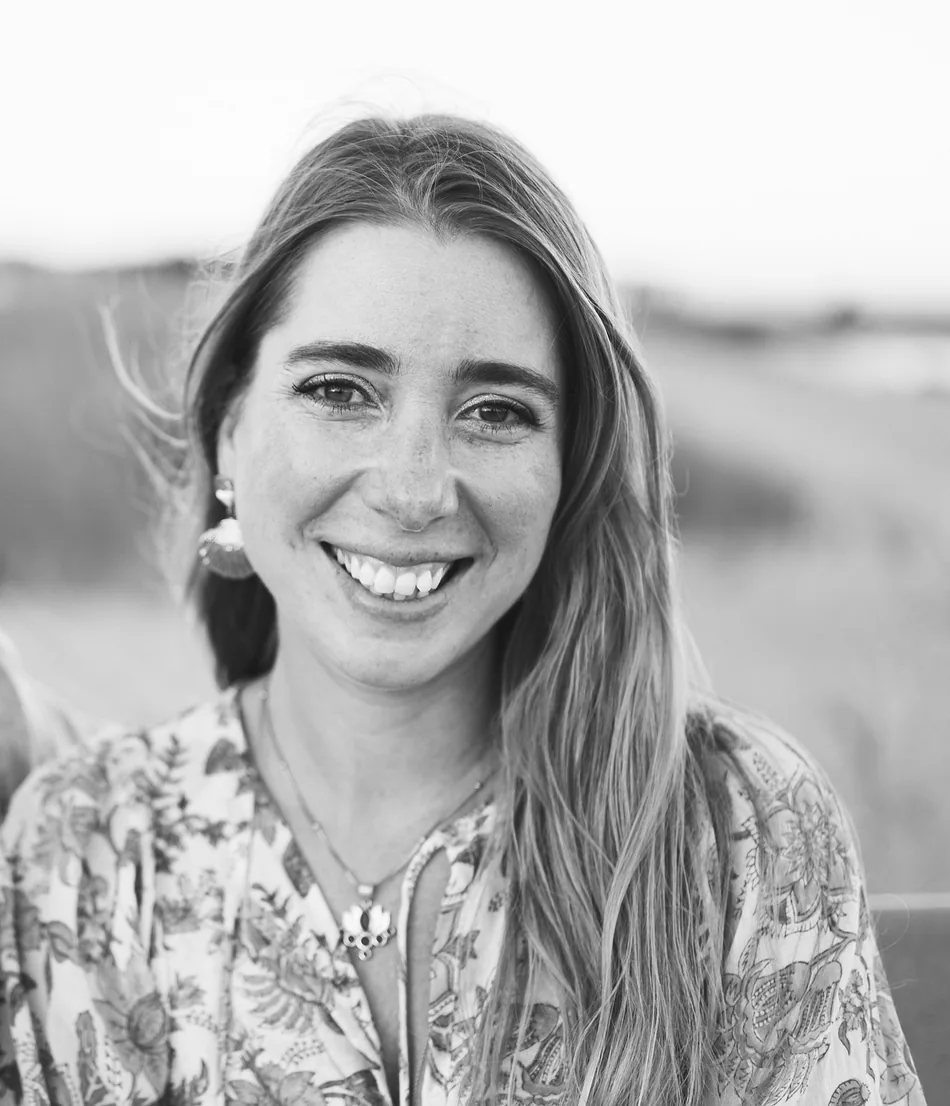 Hope Still, certified consulting hypnotist in Millbrook NY, smiling in a black-and-white portrait outdoors