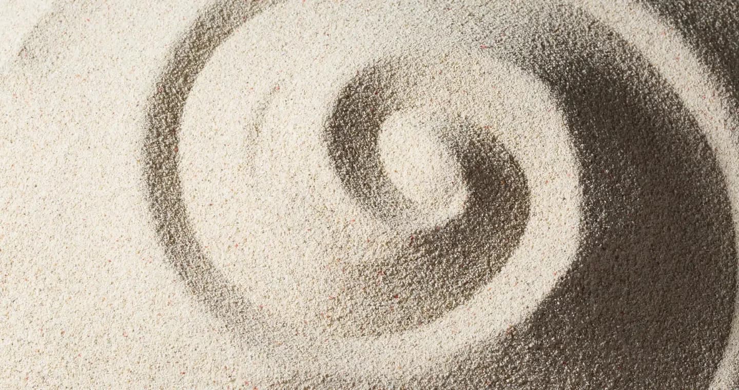 Hypnosis in Westchester County NY, a spiral raked into pale sand
