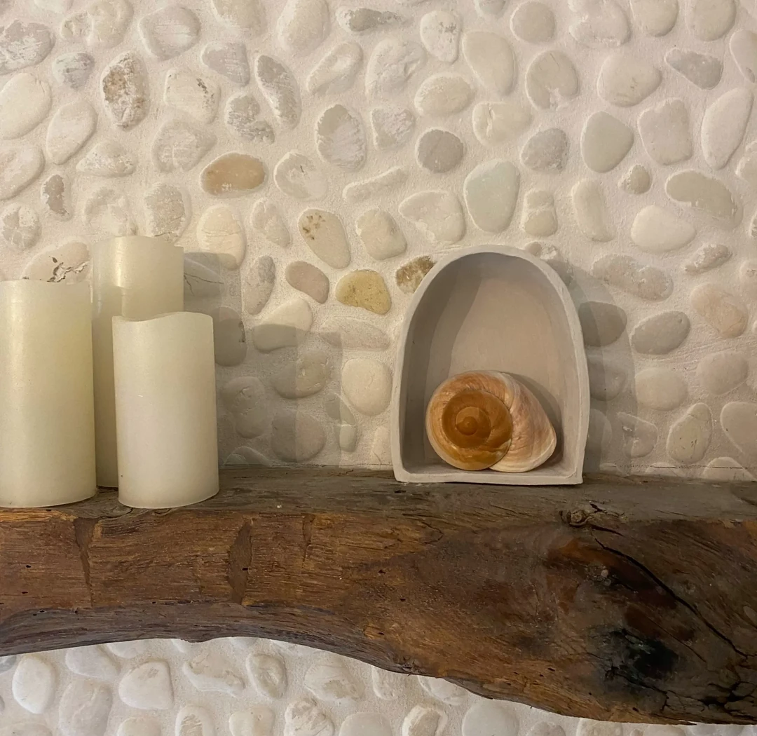 Shell niche and candle detail in the Hope Still Hypnosis studio