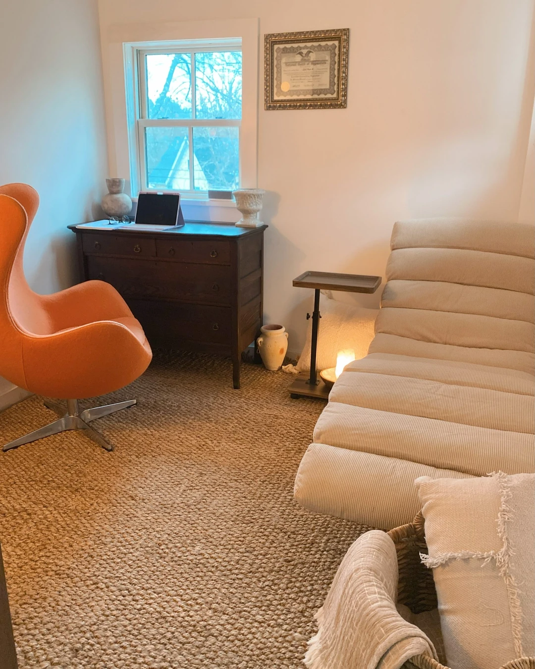 The Hope Still Hypnosis session room at BangallWorks in Stanfordville, with a reclining chair and a lit candle